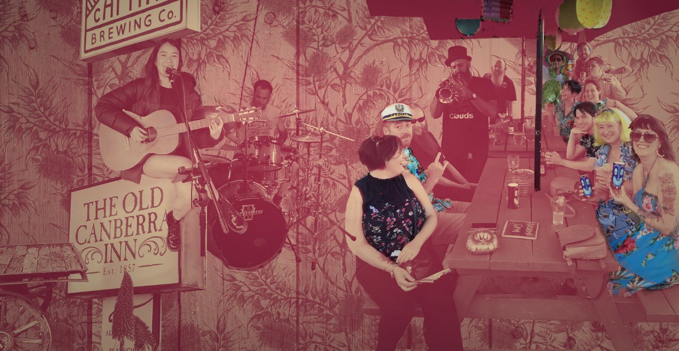 A garden party at the Old Canberra Inn — live band, long tables and the inn's own painted sign