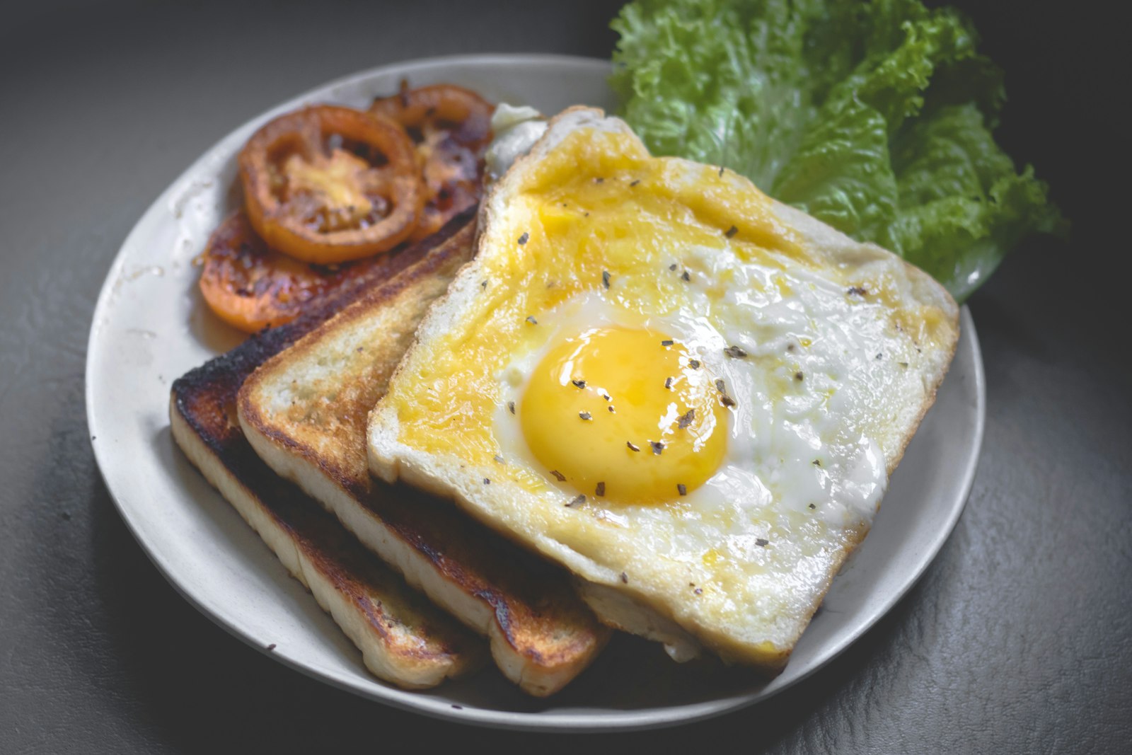 Egg on golden toast with grilled tomato — breakfast, Pepys style
