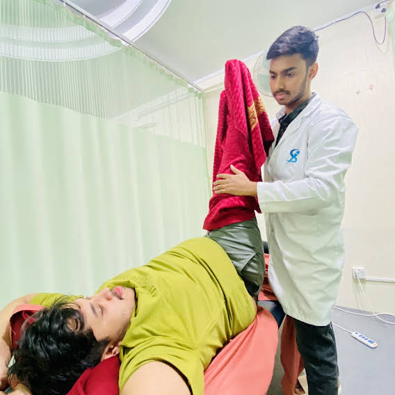 A physiotherapy session in progress at S.K Physiotherapy & Stroke Rehab Center